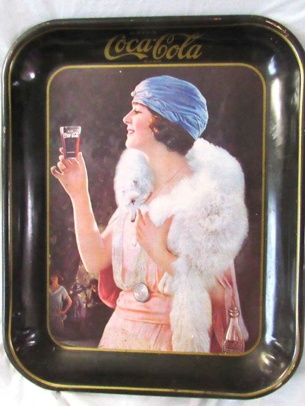 Vintage Coca Cola 13" tray with a lady in the middle.